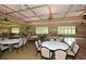 Large community room featuring tables, chairs, and large windows with natural light at 505 Appalachian Woods Dr, Canton, GA 30114
