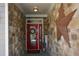 Welcoming entryway with a red front door, stone accents, and decorative elements at 505 Appalachian Woods Dr, Canton, GA 30114