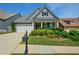 Charming single-Gathering home featuring a manicured front lawn, a two-car garage, and a welcoming entryway at 505 Appalachian Woods Dr, Canton, GA 30114