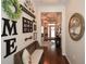 Hallway showcasing hardwood floors and decorative wall decor at 505 Appalachian Woods Dr, Canton, GA 30114