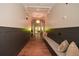 Inviting hallway with hardwood floors, modern wainscoting, and built-in bench seating at 505 Appalachian Woods Dr, Canton, GA 30114