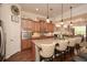 Bright eat-in kitchen with center island, pendant lights, stainless appliances, and decorative accents at 505 Appalachian Woods Dr, Canton, GA 30114