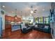 Open-concept living area featuring a stone fireplace, hardwood floors, and seamless flow to the kitchen at 505 Appalachian Woods Dr, Canton, GA 30114