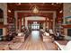 Beautifully designed community room with wood finishes, stone accents, bookshelves, fireplace, and comfortable seating at 505 Appalachian Woods Dr, Canton, GA 30114