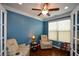 Cozy home office with comfortable seating, natural light, and hardwood floors at 505 Appalachian Woods Dr, Canton, GA 30114