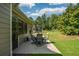 Outdoor patio features a table and chairs on a concrete surface, offering an ideal spot for outdoor relaxation at 505 Appalachian Woods Dr, Canton, GA 30114