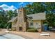 Charming pool house with stone fireplace, adding character and functionality to the pool area at 505 Appalachian Woods Dr, Canton, GA 30114