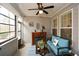Cozy sunroom with fireplace, lots of windows, and comfortable seating at 505 Appalachian Woods Dr, Canton, GA 30114
