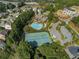 Aerial view of the community featuring tennis courts, pool, clubhouse, and surrounding homes at 6426 Queens Court Trce # 7, Mableton, GA 30126