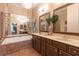 Stylish bathroom with a double vanity, soaking tub, and large mirrors at 6426 Queens Court Trce # 7, Mableton, GA 30126