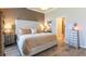 Well-furnished bedroom boasting a neutral color palette and access to the bathroom at 6426 Queens Court Trce # 7, Mableton, GA 30126