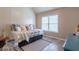 Cozy bedroom featuring a daybed, window, and wood-look floors at 6426 Queens Court Trce # 7, Mableton, GA 30126