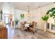 Dining area featuring decorative light fixture, round table, and stylish woven chairs at 6426 Queens Court Trce # 7, Mableton, GA 30126