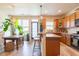 Charming kitchen features an island with bar stool seating, and updated cabinets with hardwood floors at 6426 Queens Court Trce # 7, Mableton, GA 30126
