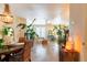 Bright dining area flowing into the living room with wood floors, decorative lighting, and plenty of natural light at 6426 Queens Court Trce # 7, Mableton, GA 30126