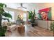Spacious living room with hardwood floors, large windows, and unique artwork, ideal for relaxation at 6426 Queens Court Trce # 7, Mableton, GA 30126