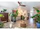 Bright living room boasting wood-look tile floors, eye-catching artwork and modern ceiling fan at 6426 Queens Court Trce # 7, Mableton, GA 30126
