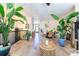 Bright living room with wood floors, large plants, and dining area, perfect for entertaining at 6426 Queens Court Trce # 7, Mableton, GA 30126