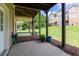 Exterior view of a covered patio with concrete flooring and a well maintained backyard at 6426 Queens Court Trce # 7, Mableton, GA 30126