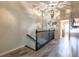 Staircase with wood flooring leads to an upstairs hallway with a unique light fixture at 6426 Queens Court Trce # 7, Mableton, GA 30126