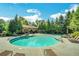 Beautifully designed swimming pool with lounge chairs and a covered area for relaxation at 6426 Queens Court Trce # 7, Mableton, GA 30126