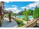 Community pool with sun loungers and umbrellas for relaxing by the water at 6426 Queens Court Trce # 7, Mableton, GA 30126