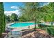 Inviting community pool surrounded by lush greenery and lounge chairs at 6426 Queens Court Trce # 7, Mableton, GA 30126