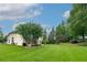 Spacious backyard featuring a well-maintained lawn and mature trees, creating a serene outdoor setting at 1000 Collingtree Ct, Mcdonough, GA 30253