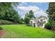 Expansive backyard featuring a lush green lawn and mature trees, creating a private outdoor space at 1000 Collingtree Ct, Mcdonough, GA 30253