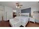 Cozy bedroom features wood floors, king bed, and ensuite bathroom at 1000 Collingtree Ct, Mcdonough, GA 30253