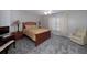 Relaxing bedroom featuring neutral walls, plush carpeting and a comfortable bed with stylish yellow bedding at 1000 Collingtree Ct, Mcdonough, GA 30253
