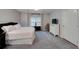 Cozy bedroom features plush carpeting, a comfortable bed, and natural light from the window at 1000 Collingtree Ct, Mcdonough, GA 30253