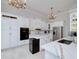 Bright kitchen featuring white cabinets, marble countertop and stainless steel appliances at 1000 Collingtree Ct, Mcdonough, GA 30253