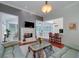 Open concept living area with fireplace, backyard access, and a view of the kitchen at 1000 Collingtree Ct, Mcdonough, GA 30253