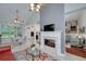 Open-concept living room with fireplace, breakfast nook, and kitchen at 1000 Collingtree Ct, Mcdonough, GA 30253