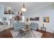 Bright open concept living area with staircase, sitting area, hardwood and marble flooring at 1000 Collingtree Ct, Mcdonough, GA 30253