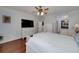 Spacious main bedroom with a ceiling fan, flat screen TV and a private ensuite bathroom and closet at 1000 Collingtree Ct, Mcdonough, GA 30253