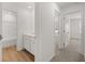 Bathroom with combination tub and shower, and stylish vanity at 1236 Arnhem Dr, Hampton, GA 30228