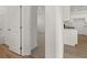 Hallway leading to kitchen, bathroom, and bedroom at 1236 Arnhem Dr, Hampton, GA 30228