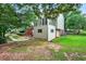 An exterior view of a home showing the backyard and deck at 2020 Ridge Gate Drive Dr, Cumming, GA 30041
