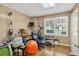 Basement workout space with fitness equipment, wood paneling, and bright natural light at 2020 Ridge Gate Drive Dr, Cumming, GA 30041
