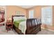 Comfortable bedroom featuring a bed and closet with ample storage space at 2020 Ridge Gate Drive Dr, Cumming, GA 30041