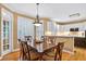 Elegant dining room with hardwood floors, shuttered windows and stylish lighting at 2020 Ridge Gate Drive Dr, Cumming, GA 30041