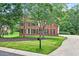 Beautiful brick home with well-maintained landscaping and a long driveway at 2020 Ridge Gate Drive Dr, Cumming, GA 30041