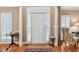 Inviting foyer with hardwood floors, a decorative rug, and ample natural light from the front door at 2020 Ridge Gate Drive Dr, Cumming, GA 30041