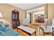 Bright living room with hardwood floors, comfortable seating, and an open view to the dining area at 2020 Ridge Gate Drive Dr, Cumming, GA 30041