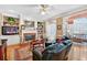 Inviting living room with a brick fireplace, hardwood floors, and built-in bookshelves at 2020 Ridge Gate Drive Dr, Cumming, GA 30041