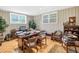 Functional home office with a large desk, chair, and natural light from the windows at 2020 Ridge Gate Drive Dr, Cumming, GA 30041