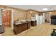 Bright home office featuring wood paneling, built in storage, and multiple doorways at 2020 Ridge Gate Drive Dr, Cumming, GA 30041
