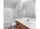 Bright bathroom featuring a shower-tub combo and a vanity with granite countertop at 2873 Snapfinger Mnr, Decatur, GA 30035